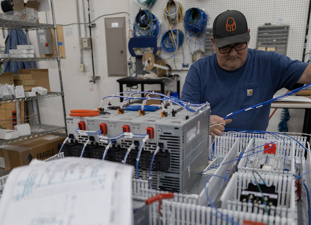 Guy working with blue cables